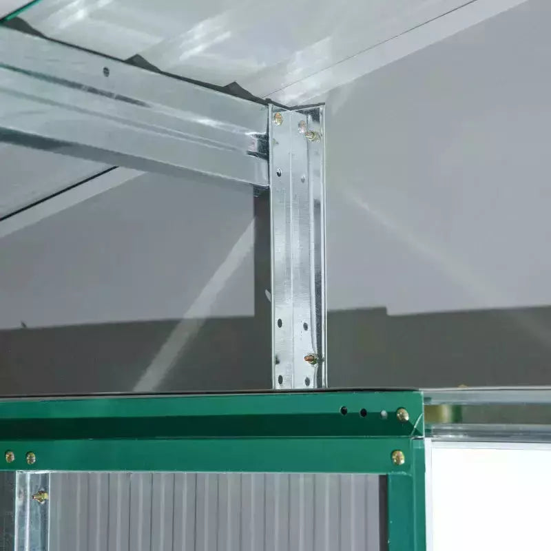Inside corner of the green shed showing the galvanised steel roof frame and bracing