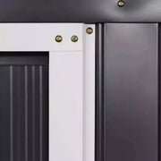 Close-up of the dark grey corrugated wall panels beside the white door frame